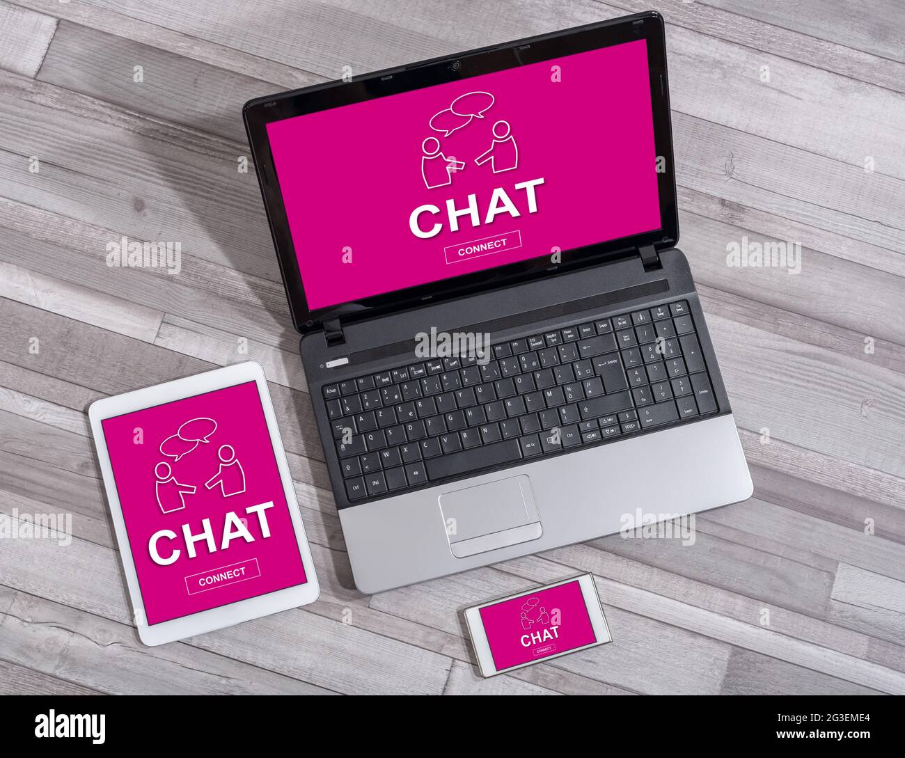 Chat concept shown on different information technology devices Stock Photo