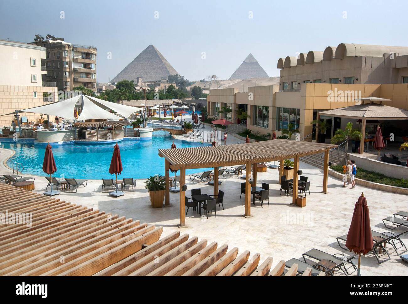 A view from a hotel swimming pool looking towards the Pyramids of Giza