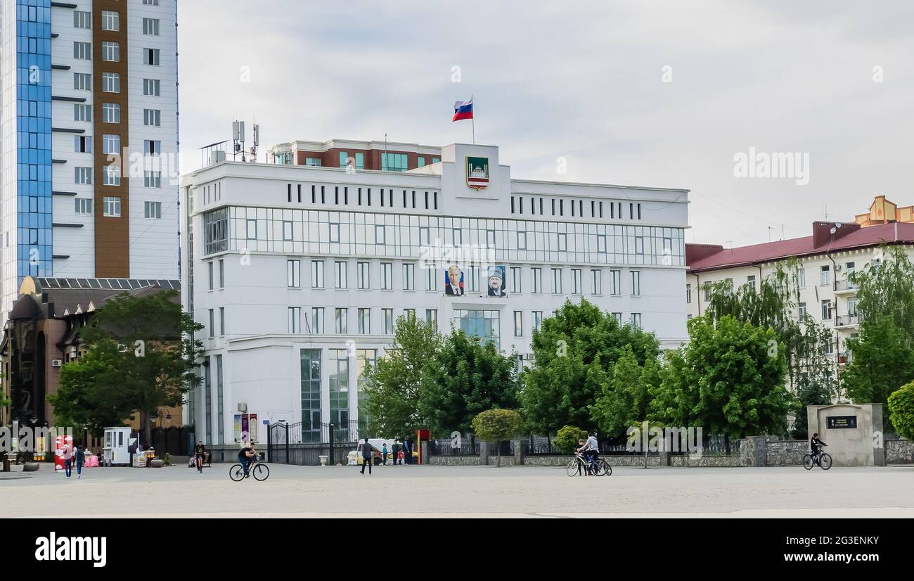 The building of the Council of Deputies of the city of Grozny  with portraits of Vladimir Putin and Akhmad Kadyrov on the facade.  Grozny,  Chechen Re Stock Photo