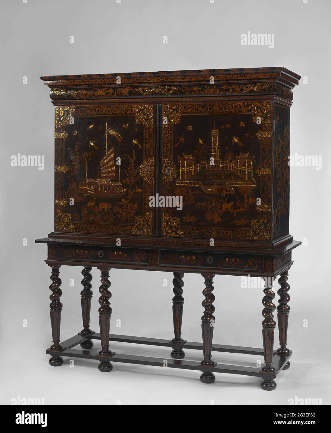 Cabinet on stand. All over Europe craftsmen tried to imitate Chinese and Japanese lacquer, but the essential ingredient, the resin from the so-called lacquer tree, could not be obtained outside East Asia. The scenes depicted on this cabinet – the ship and the tower with bells – are partly based on the earliest illustrated description of China published in Europe. Written by the Dutchman Joan Nieuhof, it was printed in Amsterdam in 1665. Stock Photo