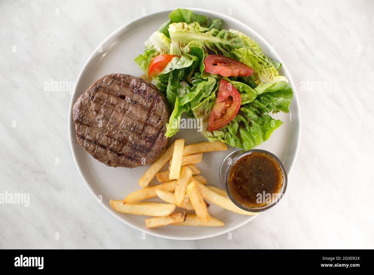 Beef Steak with Salad and French Fries Stock Photo