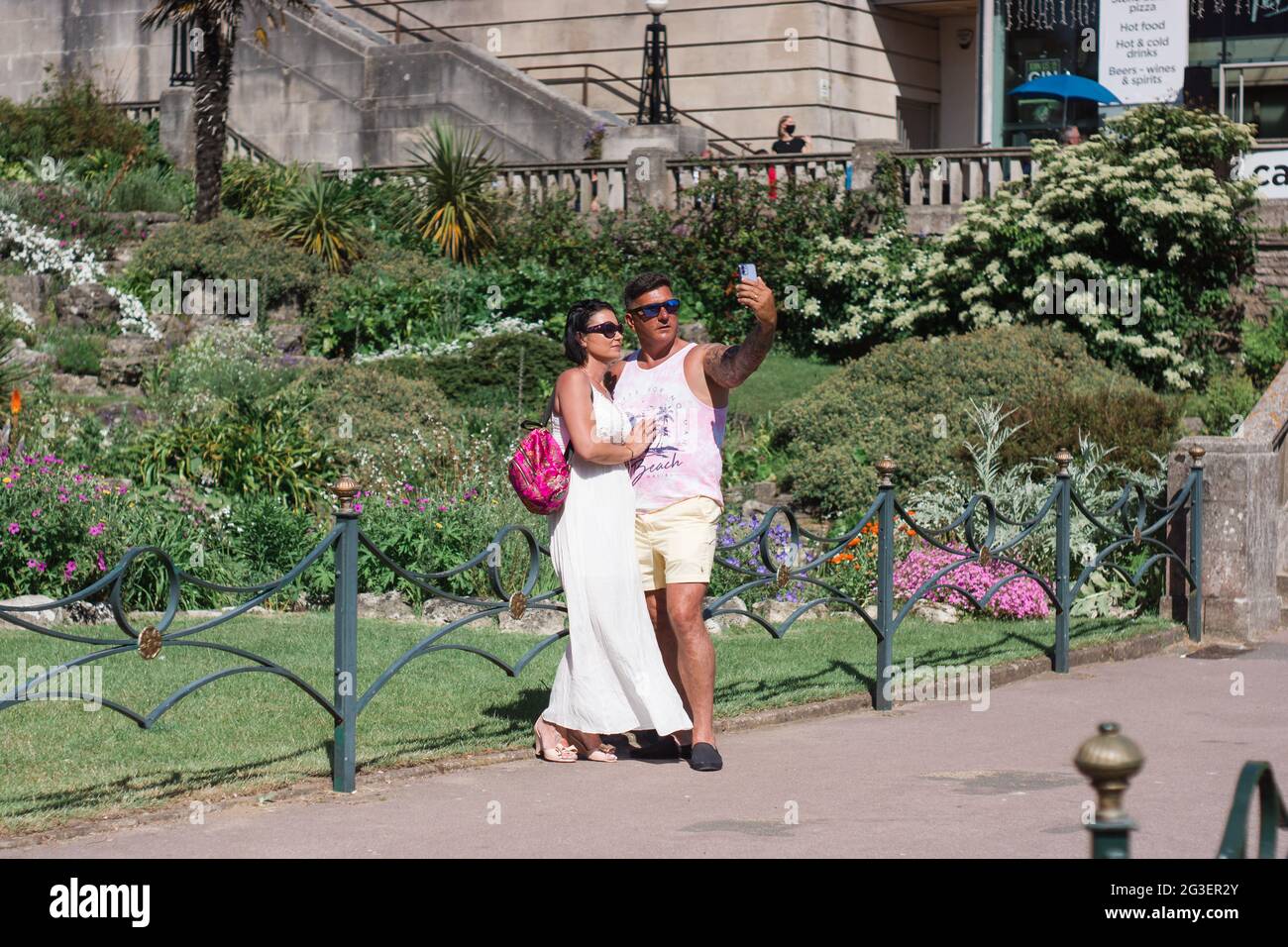 A couple take a selfie in Bournemouth Gardens, Dorset, UK Stock Photo