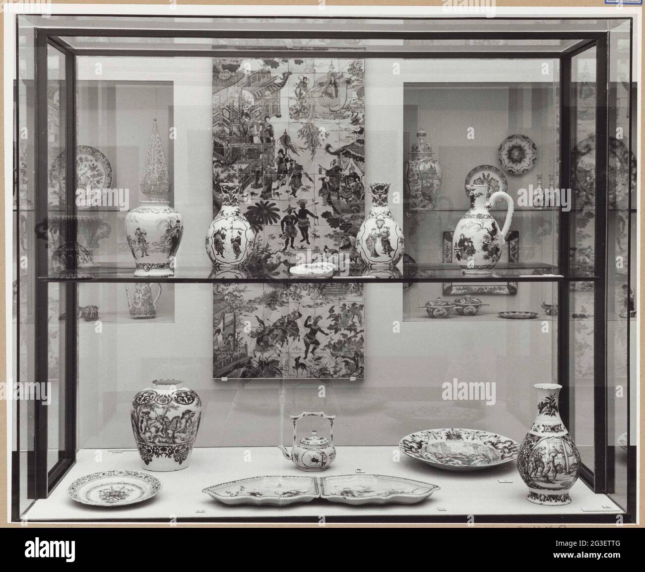 Showcase with objects of ceramics with a tile tableau behind it; Halls ...