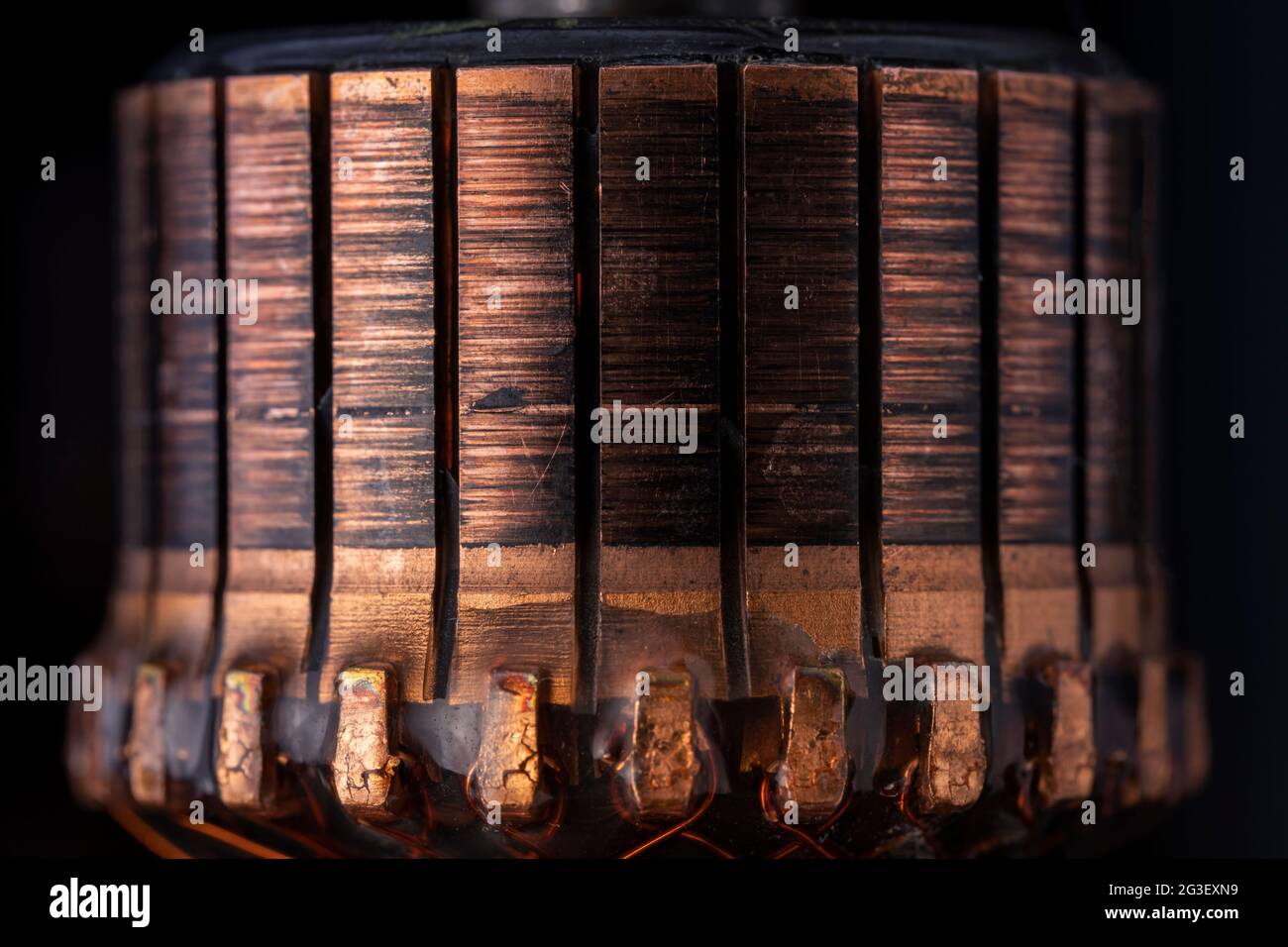 Copper commutator bar of the electric motor close up. Electric motor