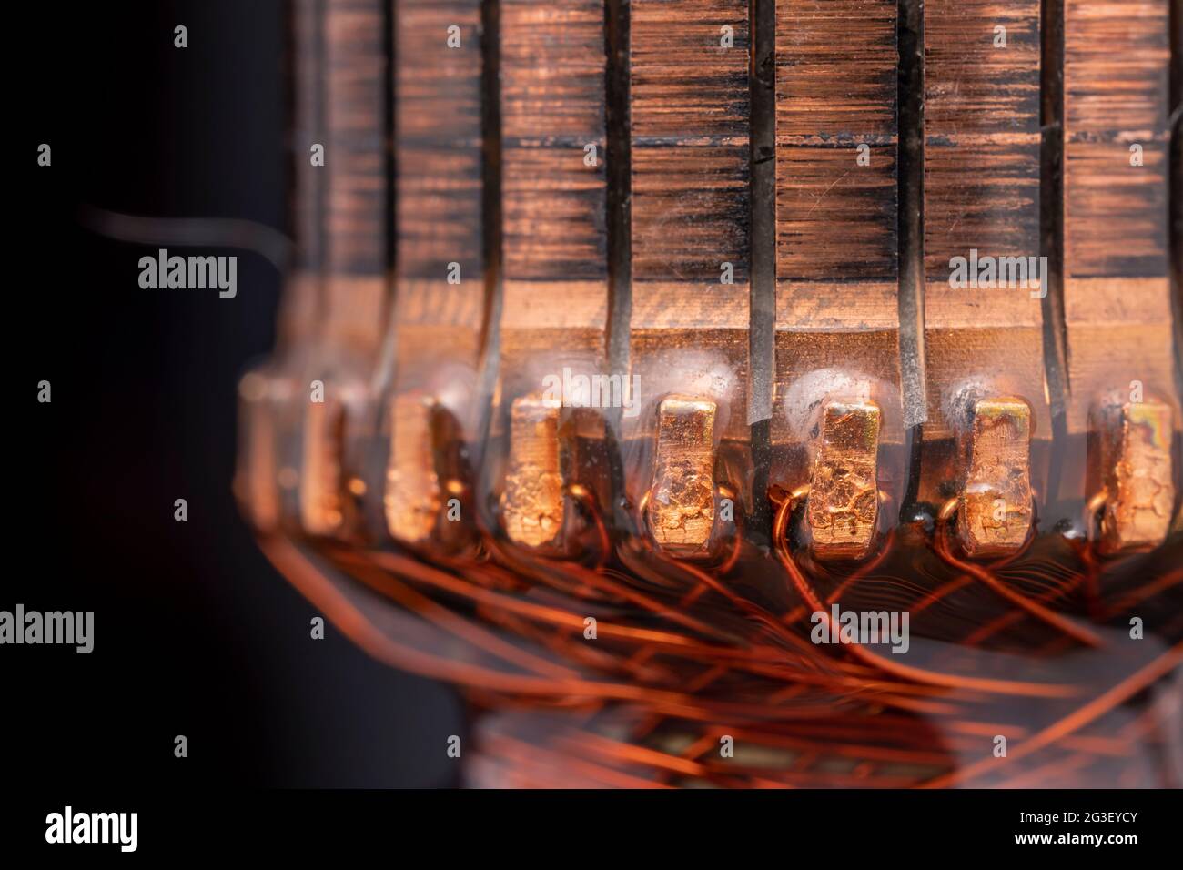 Copper commutator bar of the electric motor close up. Electric motor