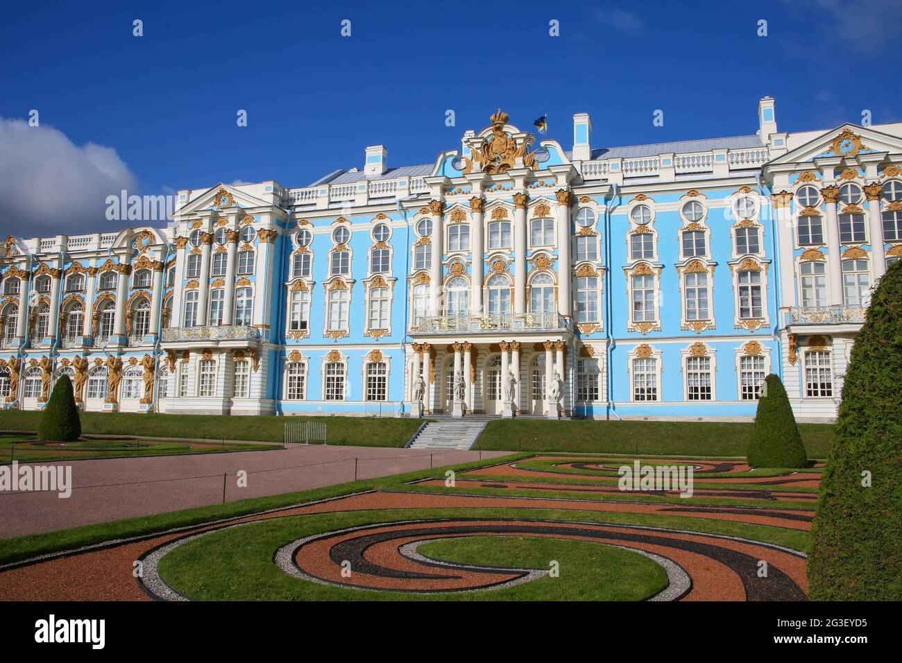 View of Catherine Palace and the gardens. Catherines Palace is a Rococo palace in Tsarskoye Selo, Pushkin, St. Petersburg, Russia. Stock Photo