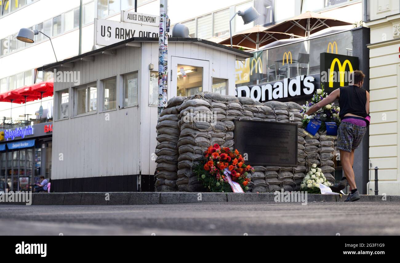 Berlin, Germany. 16th June, 2021. A man lays a wreath at Checkpoint ...