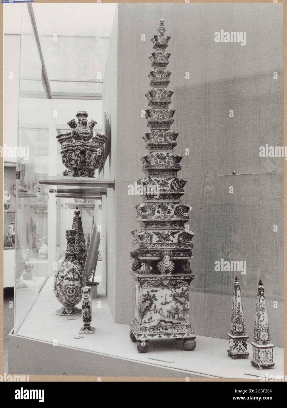 Showcase with objects of ceramics, including a flower pyramid and two ...