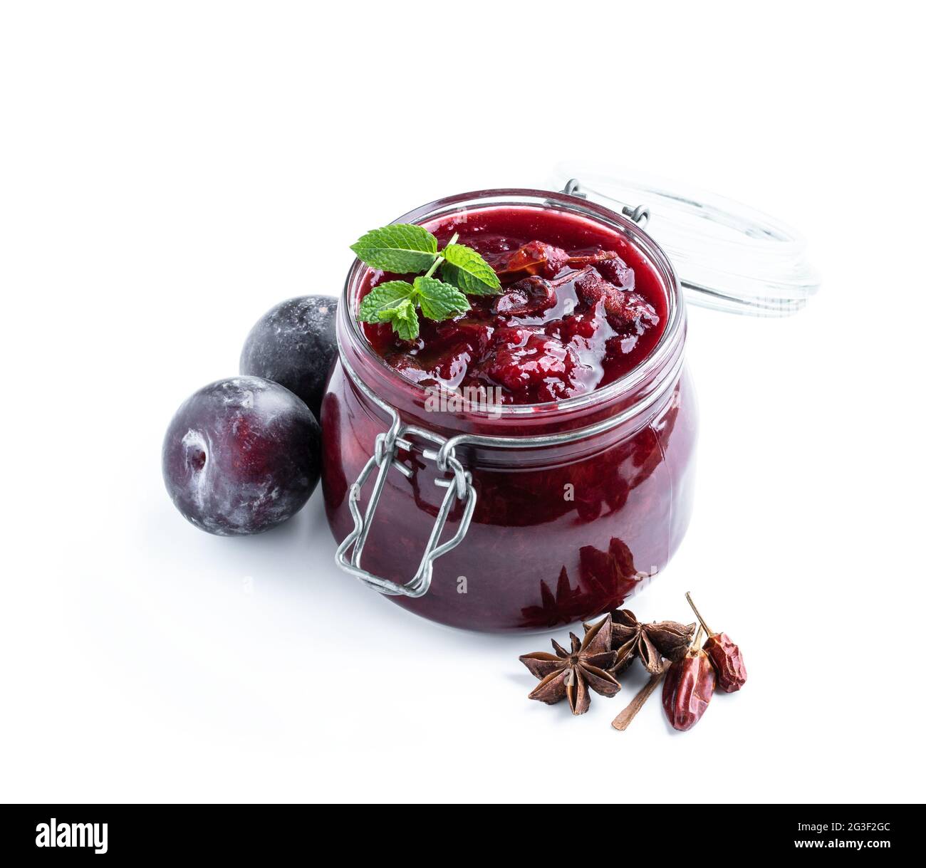 Homemade  plum chutney in glass jar isolated on white Stock Photo