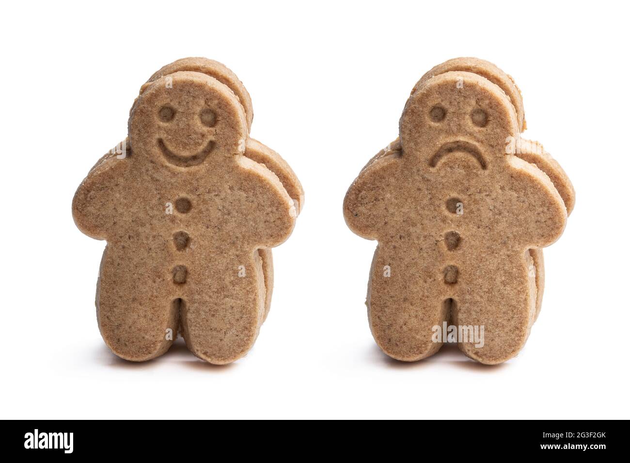 Conceptual  set of happy and unhappy gingerbread man cookies isolated on white Stock Photo