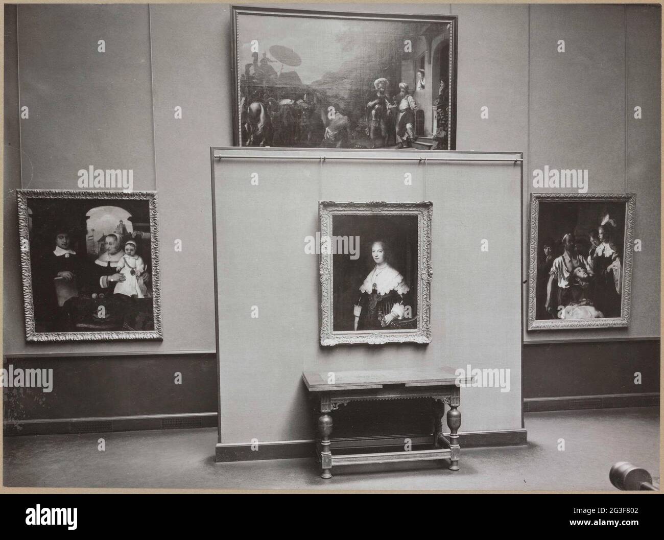 Room with paintings by the early Rembrandt school, including a portrait