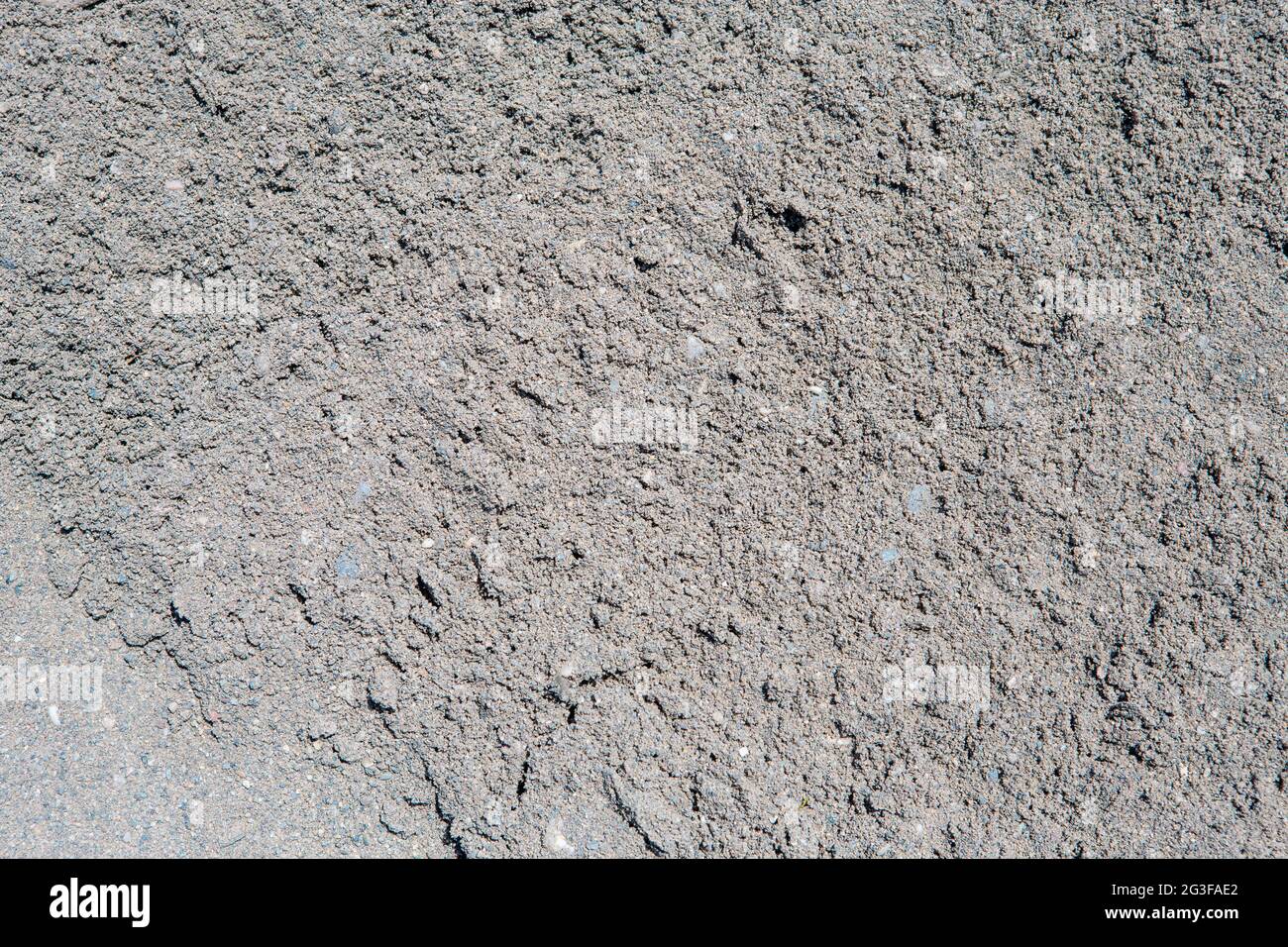 close-up shot of gray sand and pebbles ideal for use as background or texture Stock Photo