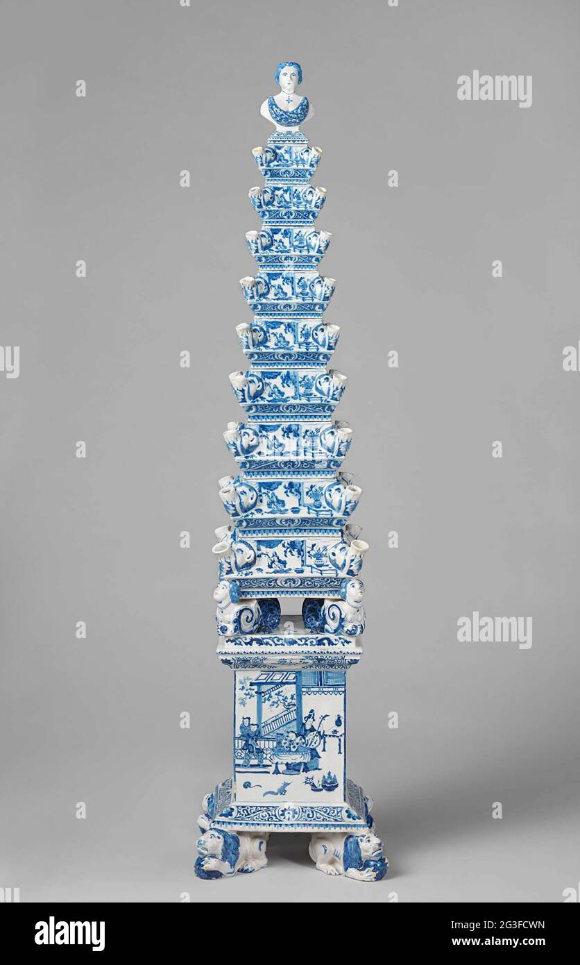 Flower pyramid. Costly cut flowers could be placed in each spout of this flower pyramid, which is built up of separate elements. The model of this tall, stacked flower vase originated at the court of William and Mary, his consort, who was passionately interested in flower arrangement, porcelain and tin-glazed earthenware. Stock Photo