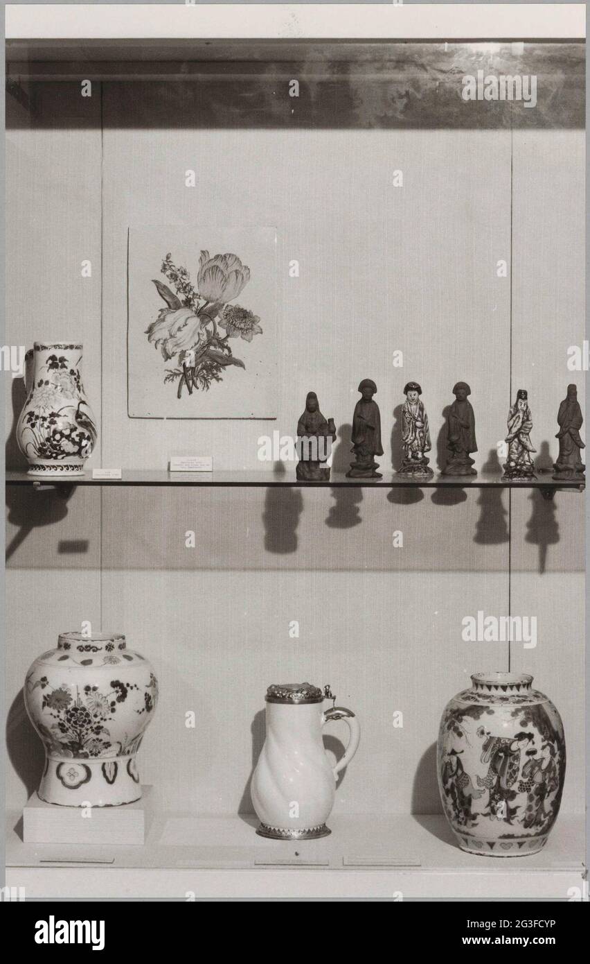 Showcase with objects of delft pottery (polychrome) and figurines of ...