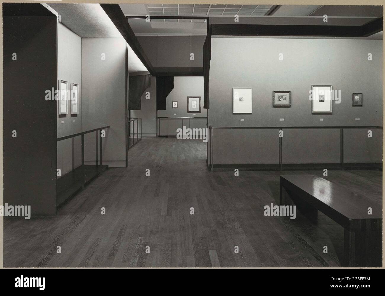 Room with various prints, a bank for visitors and a passage; Rembrandt