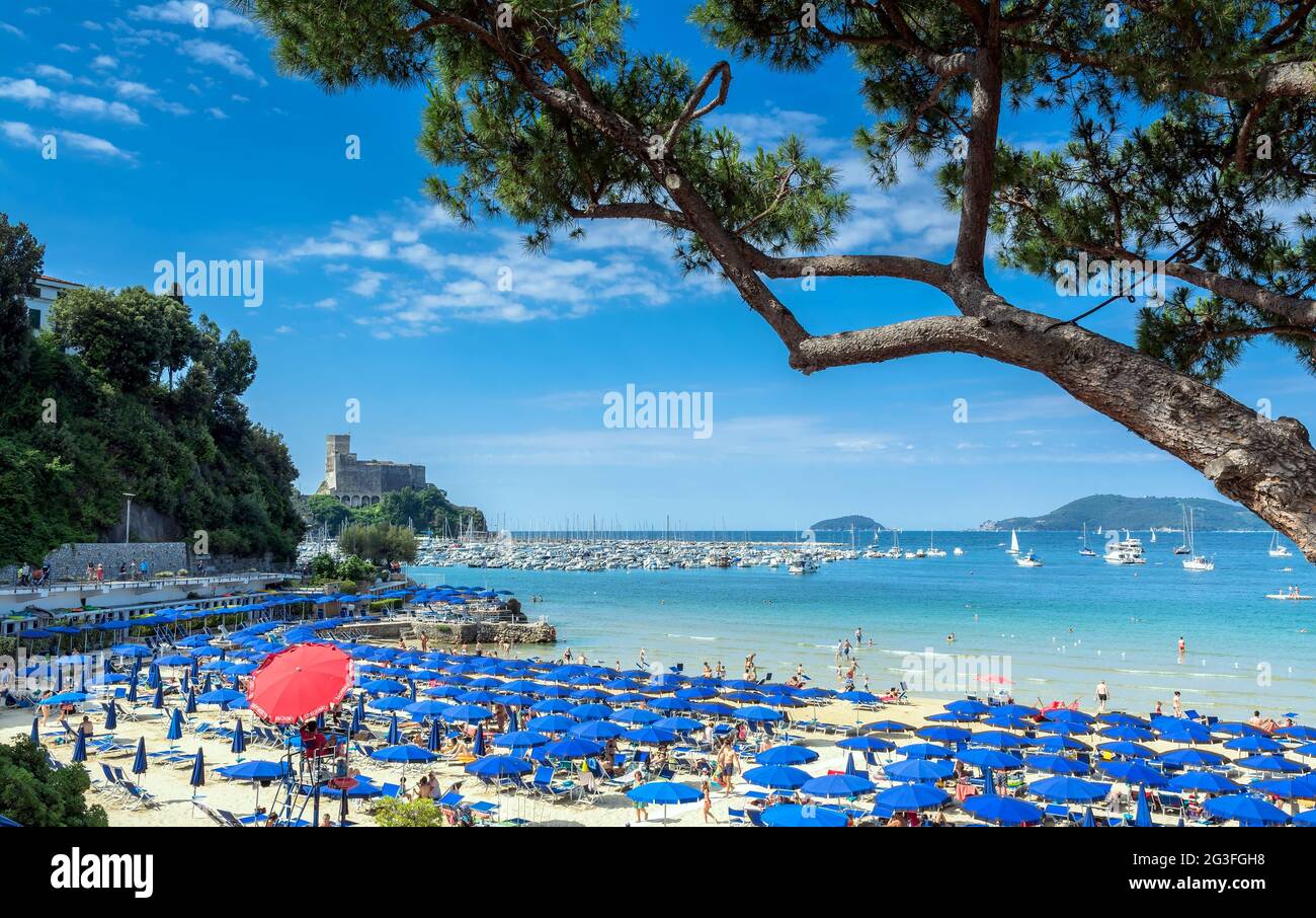 Lerici, Italy - June 18, 2017: locals and tourists enjoy beach and town in Lerici, Italy. Lerici is located in La Spezia Gulf of Poets, Liguria Stock Photo
