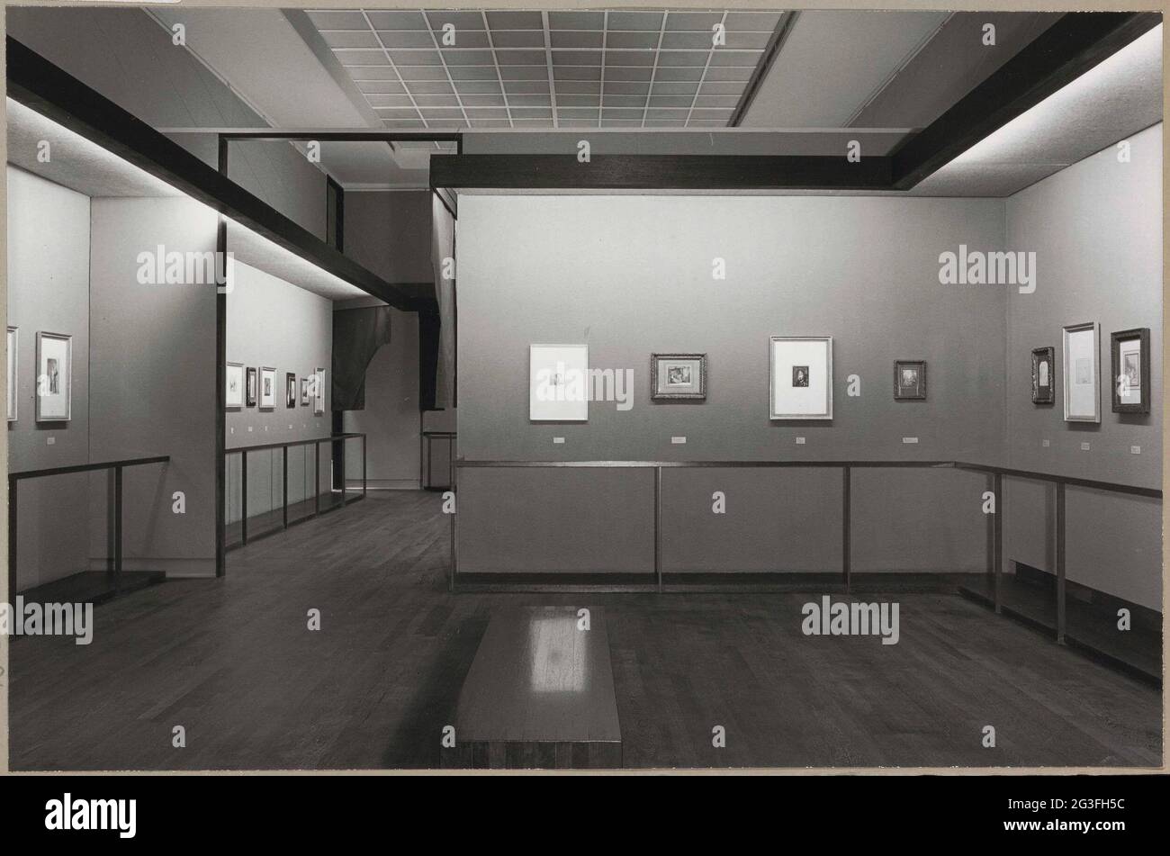 Room with various prints, a bank for visitors and a passage; Rembrandt