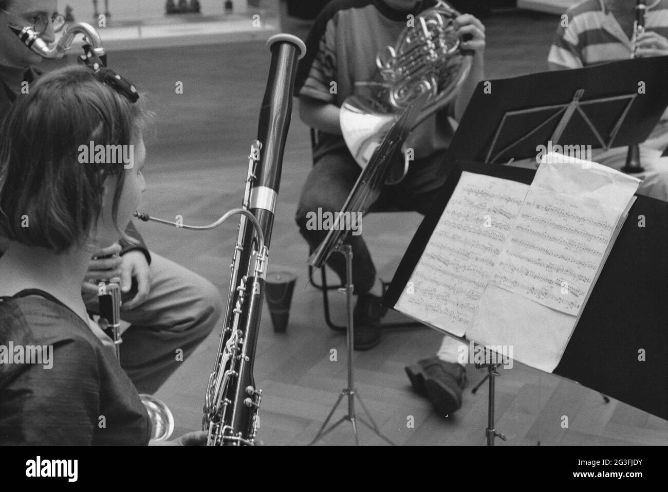 Blowing into the wind instruments Black and White Stock Photos & Images ...