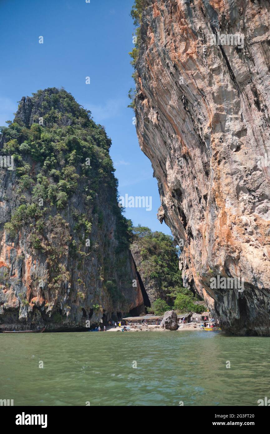 Sheer cliffs and a beach in between at Phang Nga Bay Thailand Stock Photo