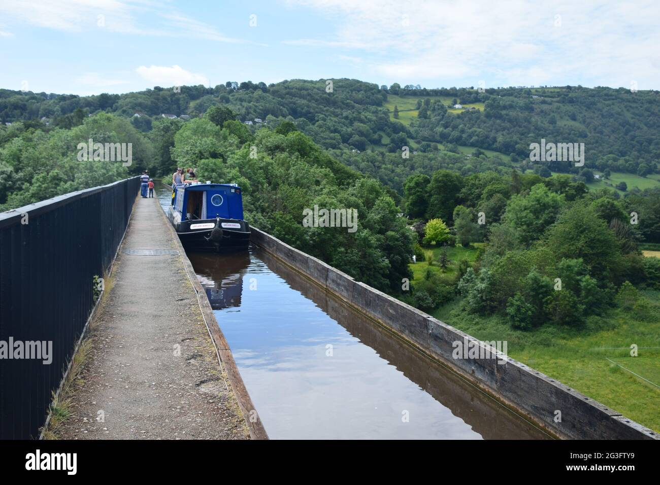 Thomas Telford's impressive Pontcysyllte Aqueduct spanning the  valley of the River Dee, with views from the river and canal boats crossing over top. Stock Photo