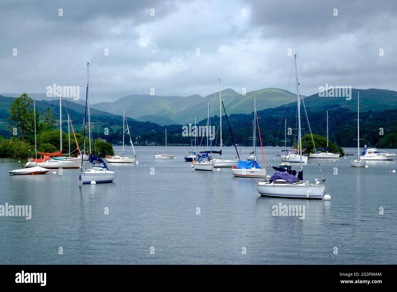 Sailing boats moored on Lake Windermere in the Lakes District, England, UK Stock Photo