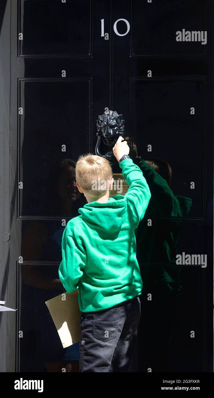 London, UK. 16th June, 2021. 9 year old Thomas Braun, with his proud mother, delivers a hand-written letter to the Prime Minister Boris Johnson in 10 Downing Street, asking for help getting a medical cannabis prescription for his brother who suffers from epilepsy Credit: Phil Robinson/Alamy Live News Stock Photo