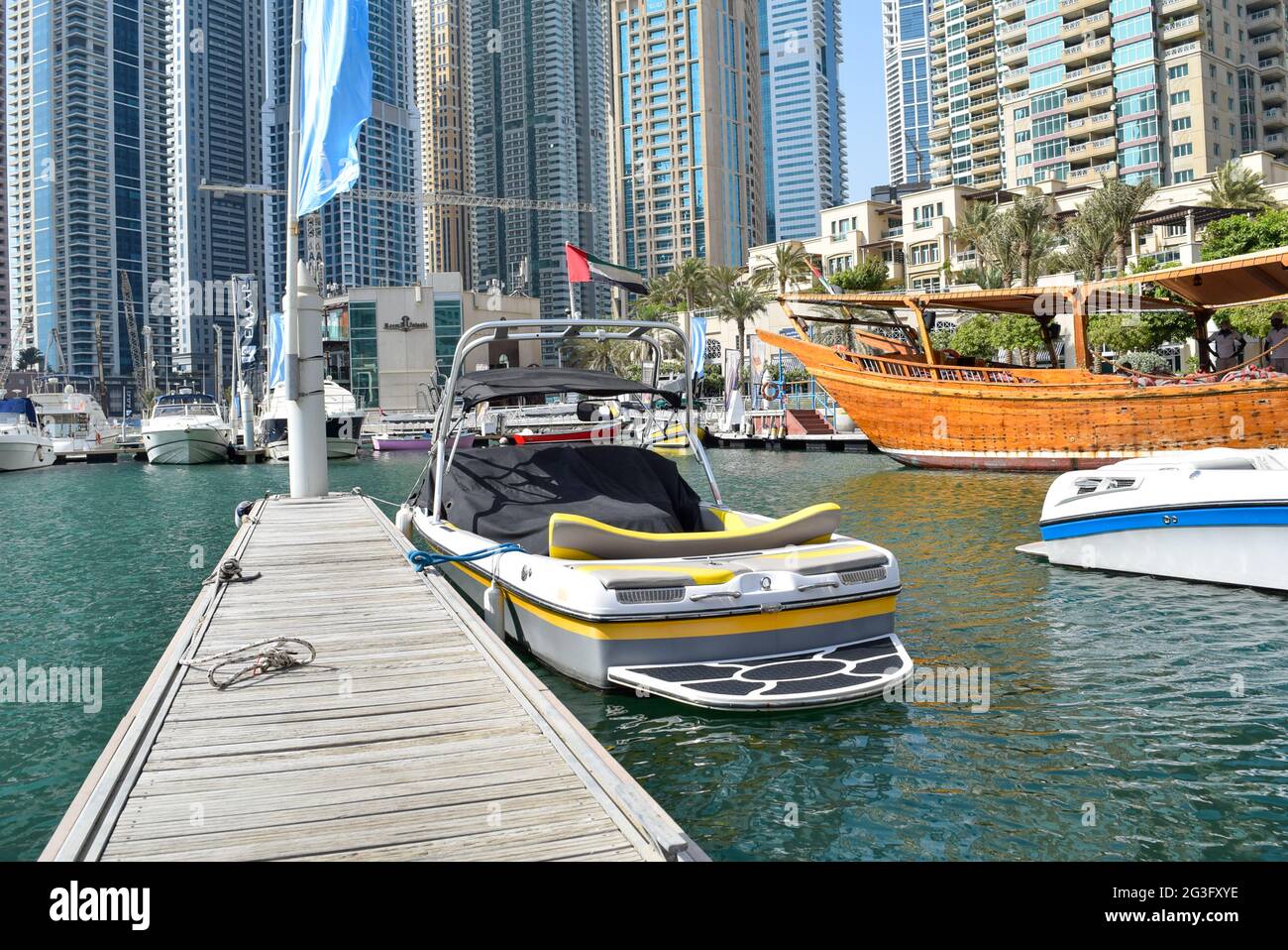 Luxury yachts in Dubai Harbour Marina, wooden boat Stock Photo Alamy