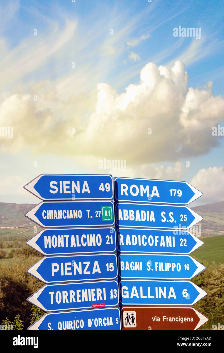 Road signs pointing different directions in Tuscany Stock Photo