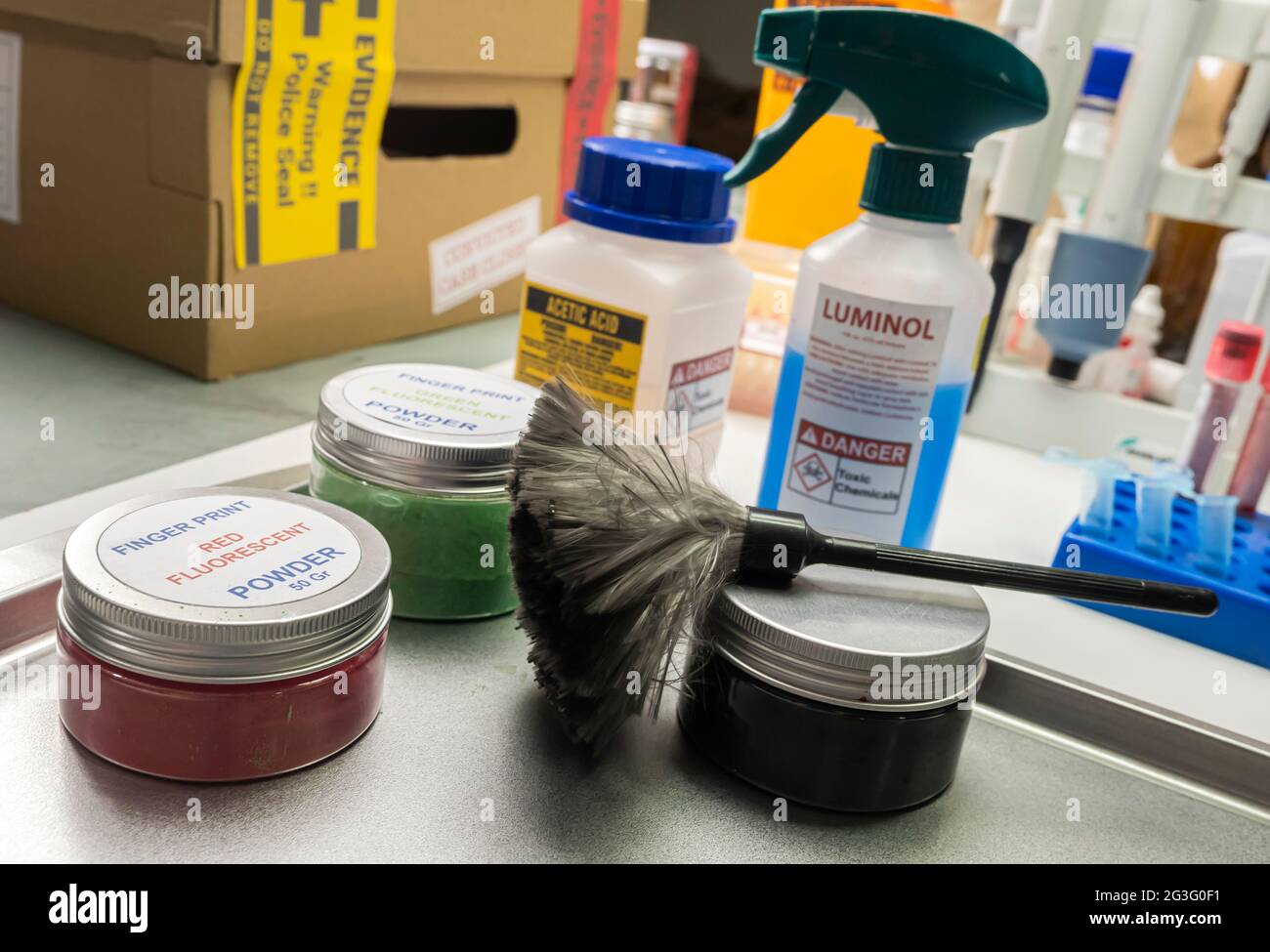 Brush to develop fingerprint powder in crime lab for analysis, concept