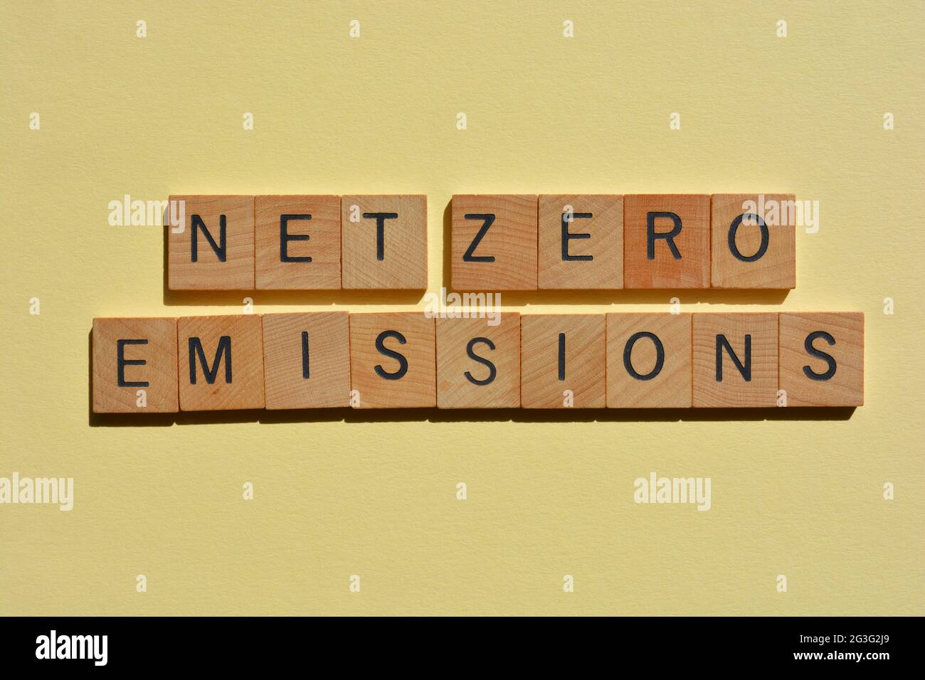 Net Zero Emissions, phrase in wooden alphabet letters isolated on plain background Stock Photo