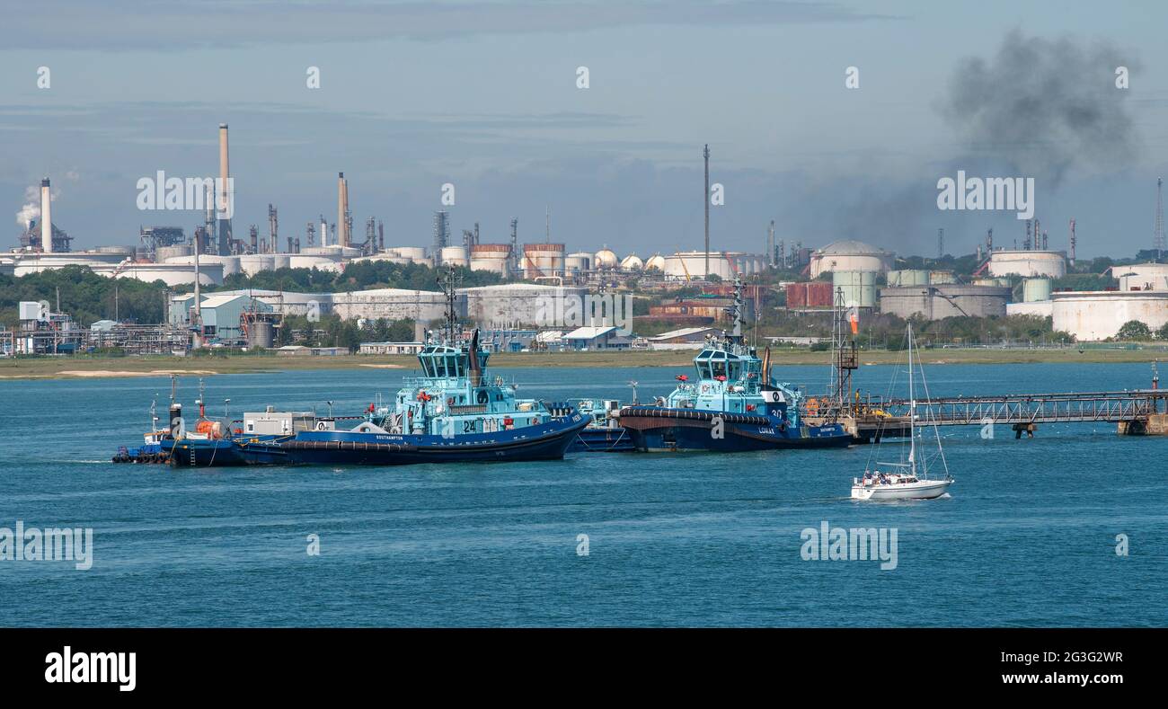 Southampton Water, England, UK. 2021. Landscape view of Fawley refinery and tugs berthed on Southampton Water, UK Stock Photo