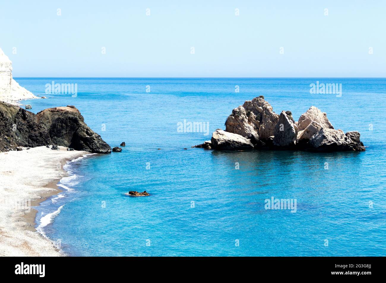 Mediterranean sea beach. White sand beach with lonely rock. Summer day seascape. Clear Water texture. Aerial view, sunny day over sea or ocean Stock Photo