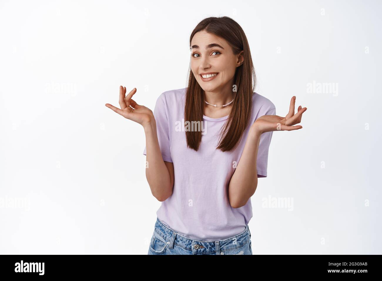 Smiling girl shrugging hires stock photography and images Alamy