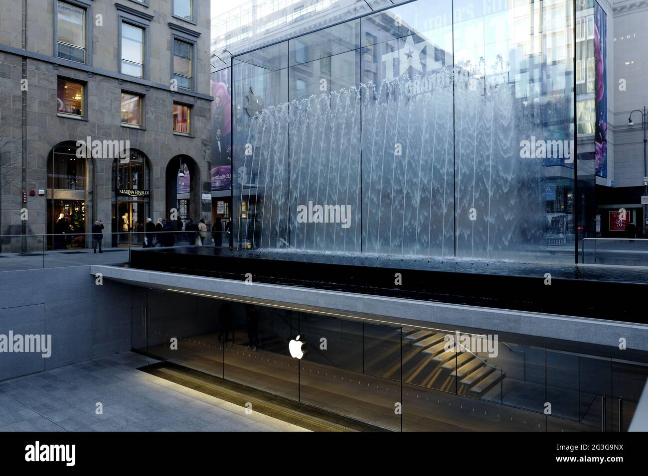 Apple store entrance gate, with the fountain cube glass, in Liberty square, in Milan. Stock Photo