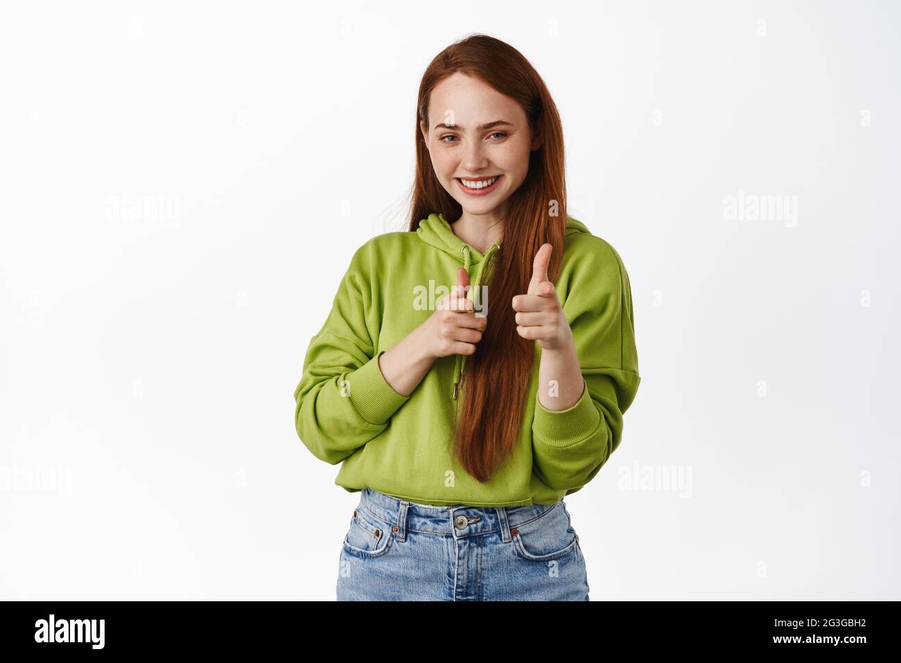 Bang you got this. Smiling teen redhead girl pointing fingers at camera,  inviting, congratulating you, inviting to event, standing over white Stock  Photo - Alamy