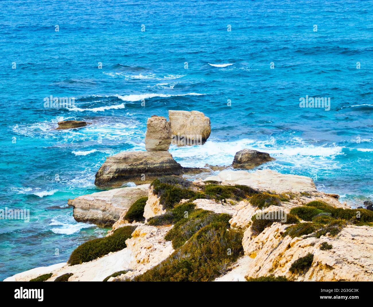 Ocean waves splash against beach with rocks background, Cliffs in the sea, Top aerial view of