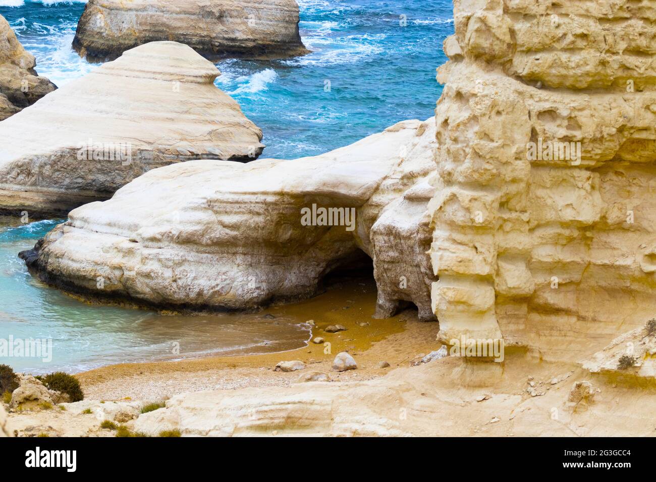 Ocean waves splash against beach with rocks background, Cliffs in the sea, Top aerial view of