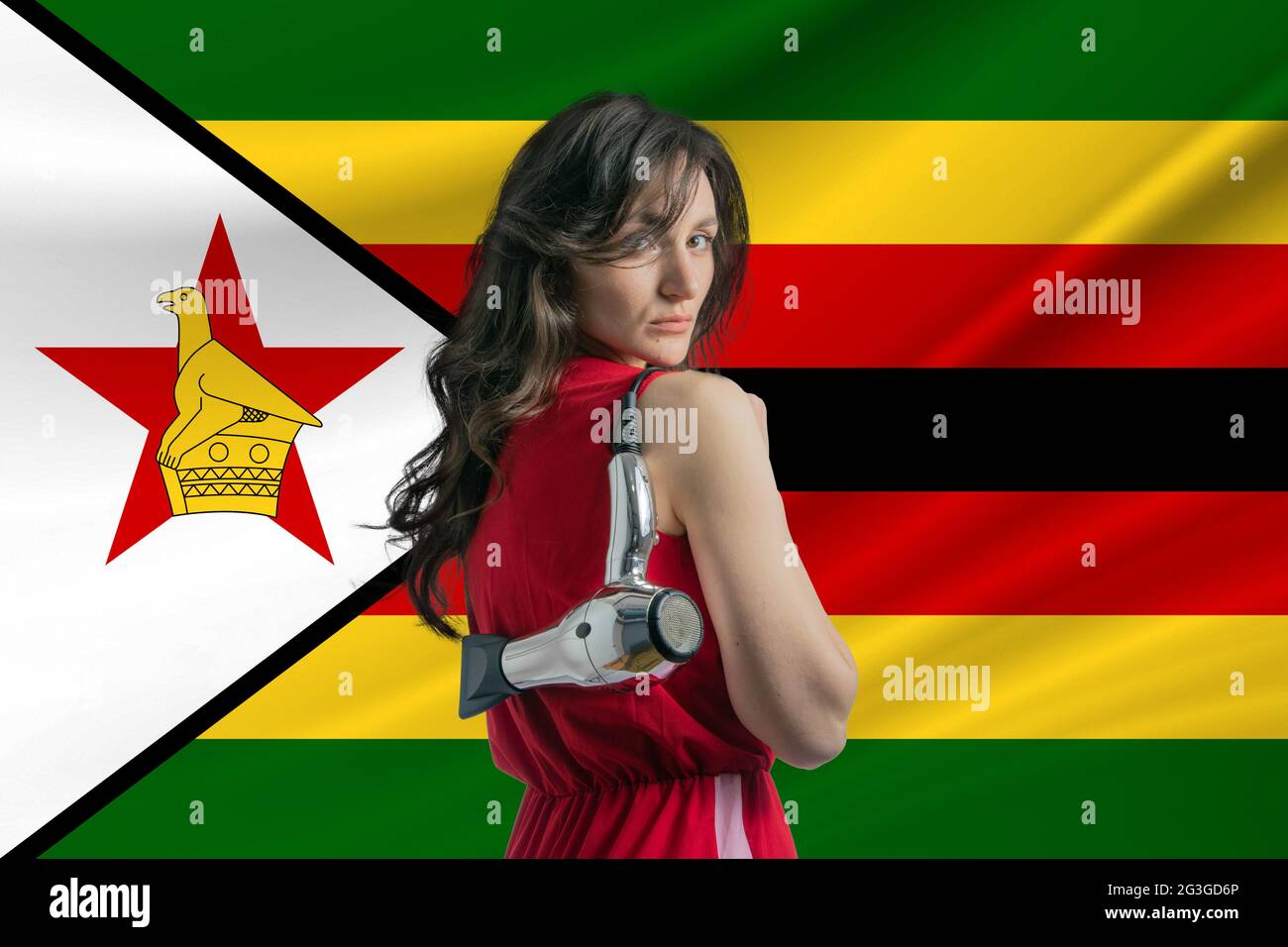 Beauty industry in Zimbabwe Happy female hairdresser holding hairdryer