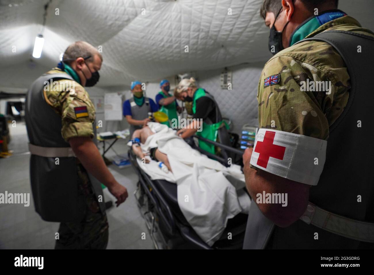 Medical staff from the military services during a test of the Army Medical Service's Mytchett based 22 Field Hospital, at Barton Stacey in Hampshire. The 22 Field Hospital is about to assume the mantle of the Army's High Readiness Hospital, meaning they can expect to be put on five days' notice to deploy - that could be to serve on an overseas operation, or to provide humanitarian relief in the case of a natural disaster anywhere around the world. Picture date: Wednesday June 16, 2021. Stock Photo