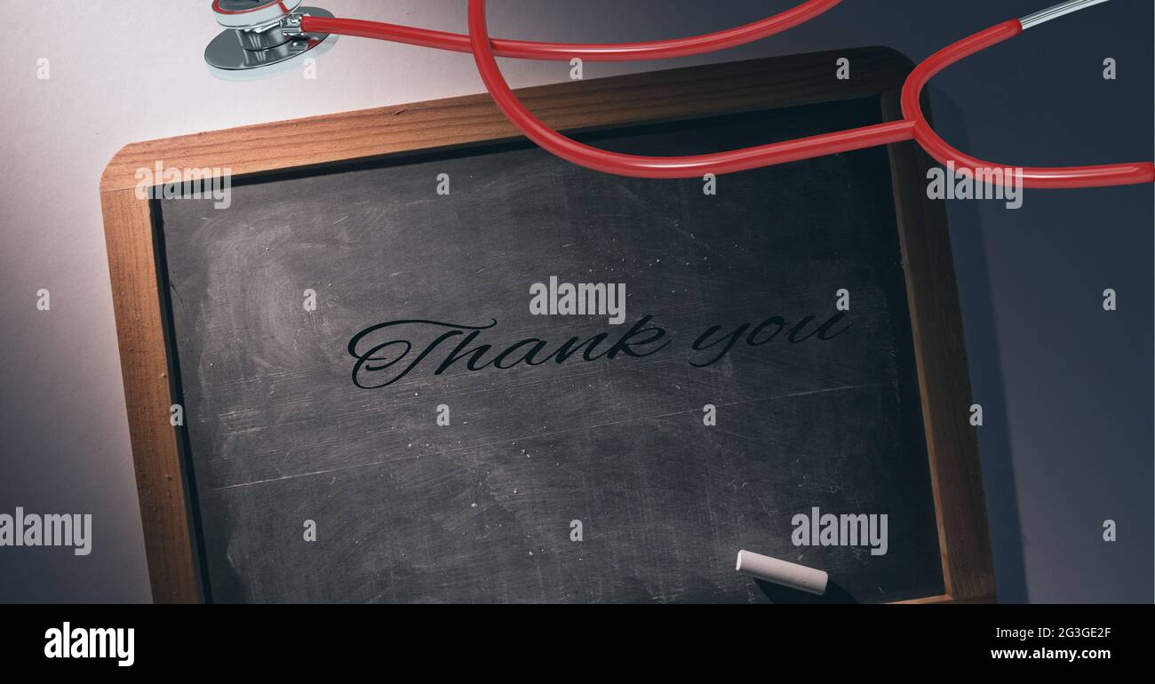 Thank you text, chalk and stethoscope over a wooden slate against grey background Stock Photo