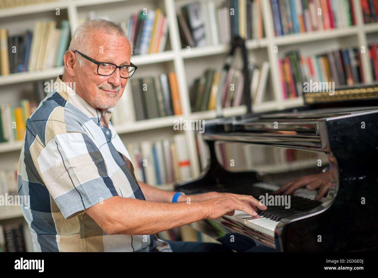 Munich, Germany. 15th June, 2021. The singer Konstantin Wecker photographed during a photo session for the Deutsche Presse-Agentur in his apartment. The musician's new album 'Utopia' will be released on 18.06.2021. Credit: Peter Kneffel/dpa/Alamy Live News Stock Photo