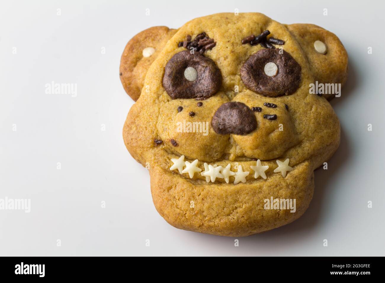 Cookie for a fan of Freddy Fazbear - Five nights at Freddy animatronic game - Ginger bread man cookie on white Stock Photo