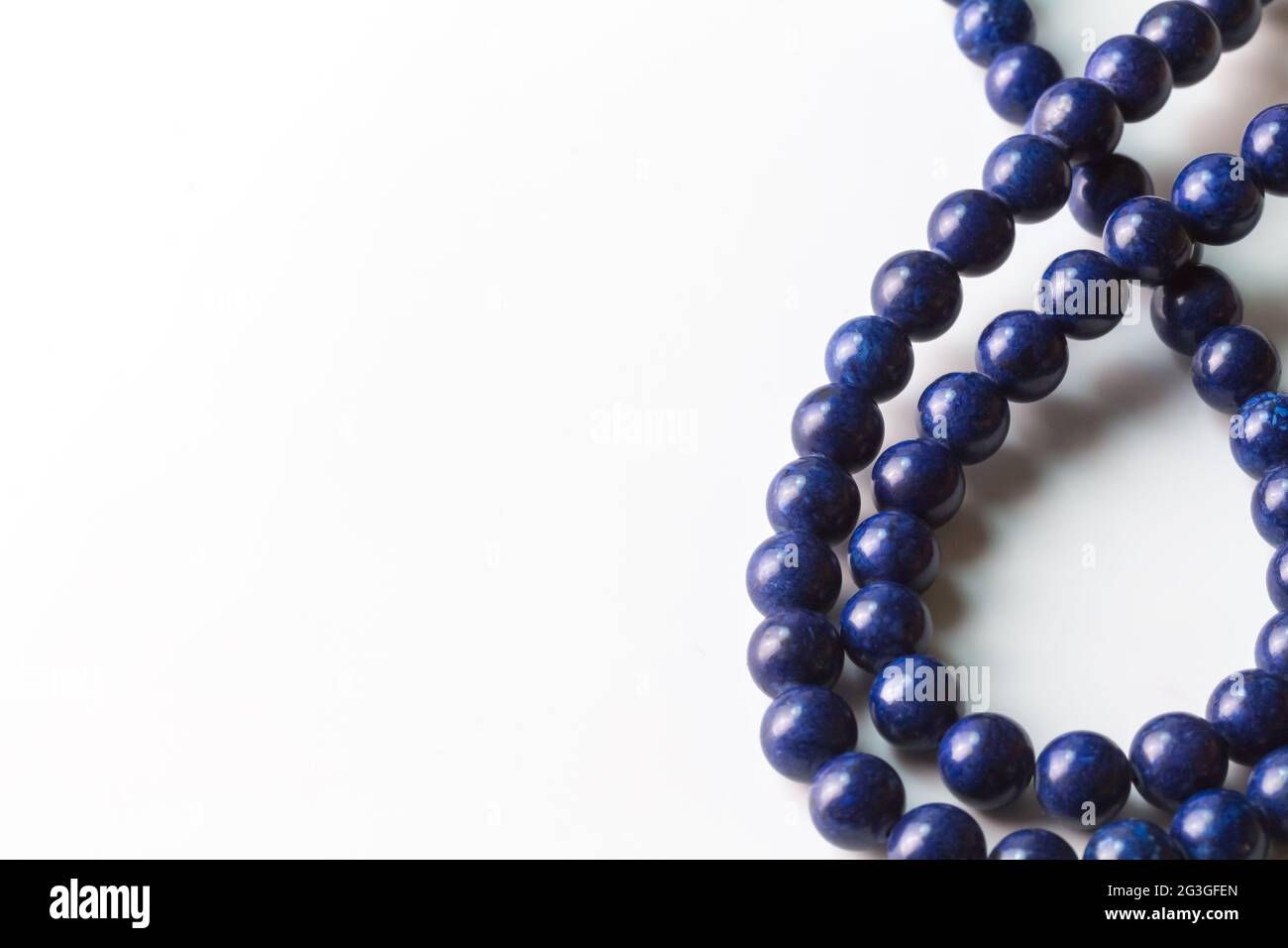 Lapis Lazuli bead necklace isolated on white with space for text - selective focus Stock Photo