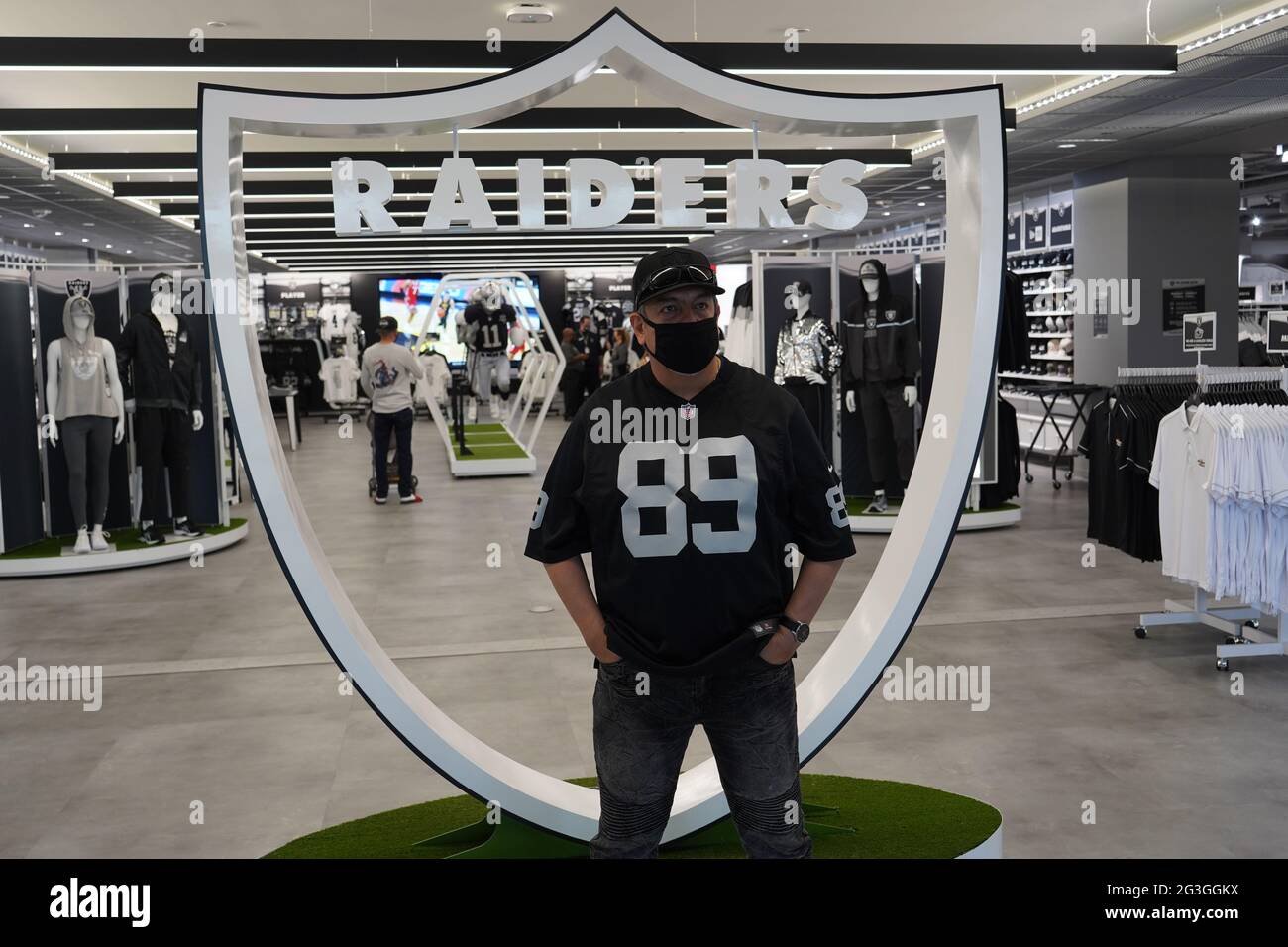 A man poses inside the Raider Image team store at Allegiant Stadium, Sunday  March 7, 2021, in Las Vegas. The stadium is the home of the Las Vegas  Raiders and the UNLV