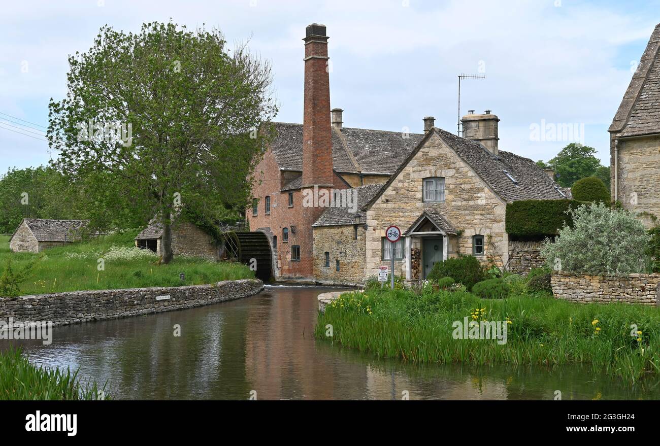 The Old Mill in the Cotswold village of Lower Slaughter which stands on the River Eye. It is a popular tourist destination in this part of Gloucesters Stock Photo