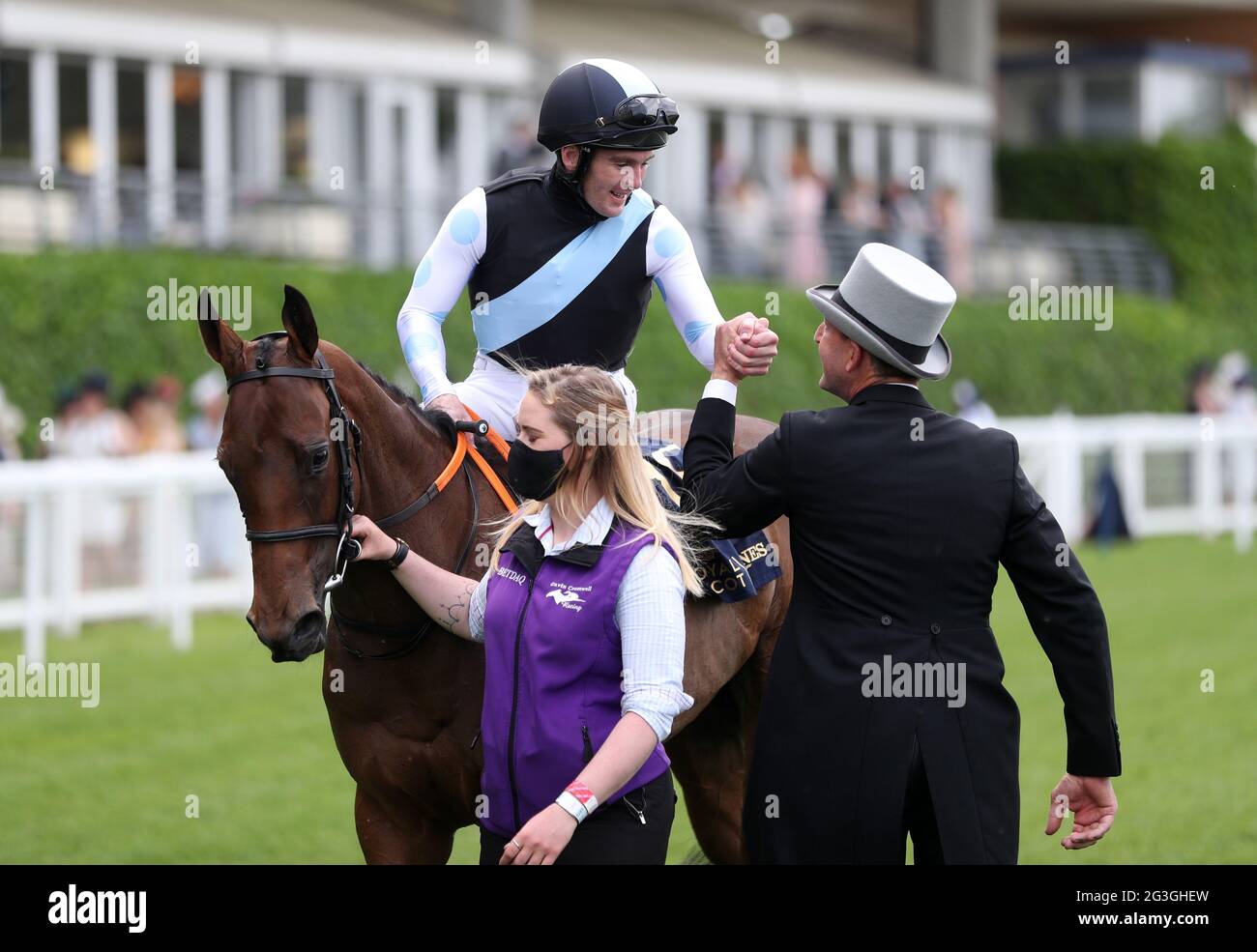 Gary Carroll celebrates on board Quick Suzy with trainer Gavin Cromwell after winning the Queen Mary Stakes during day two of Royal Ascot at Ascot Racecourse. Picture date: Wednesday June 16, 2021. Stock Photo