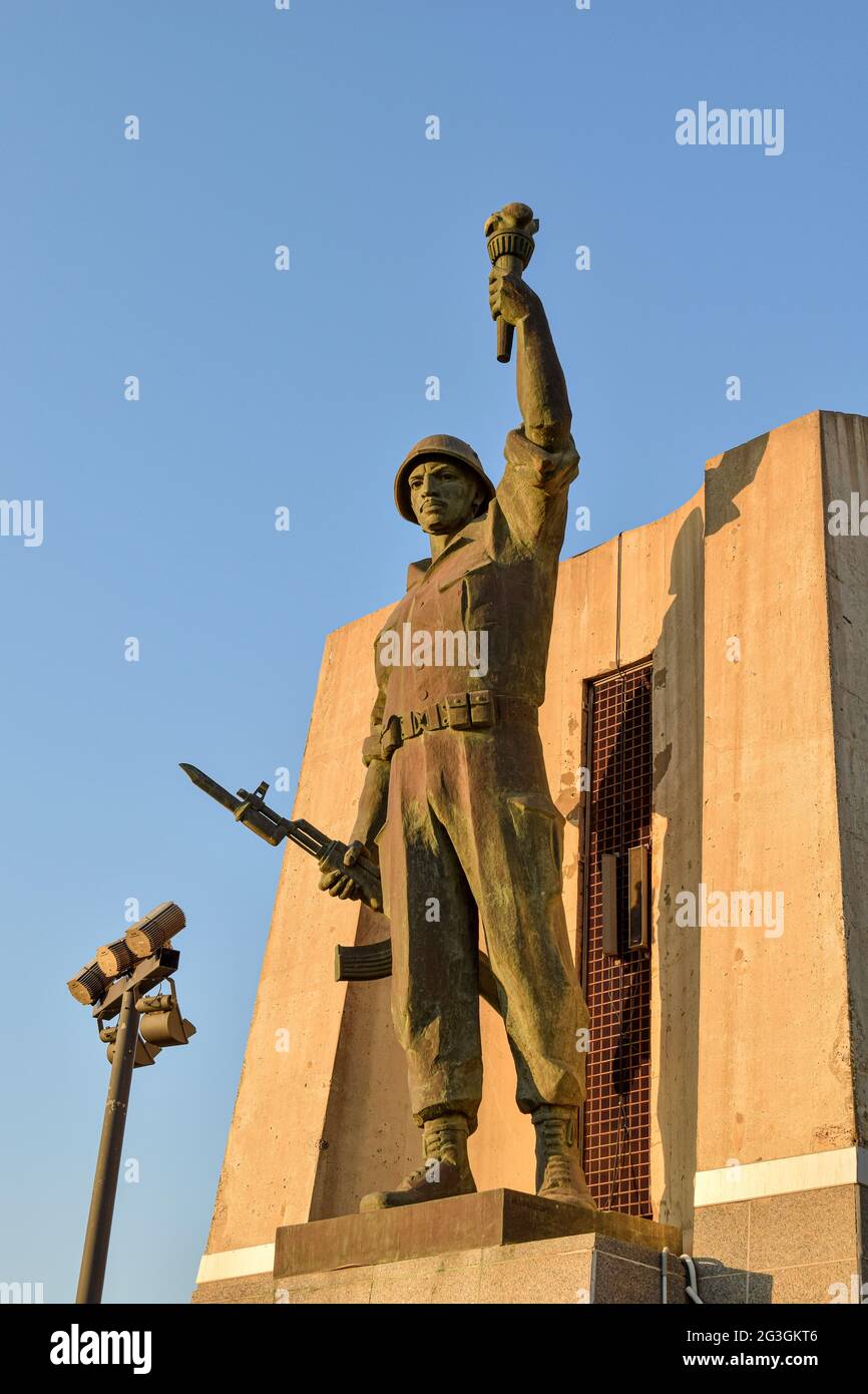 Soldier statue holding a torch and gun in Maqam Echahid monument. Stock Photo