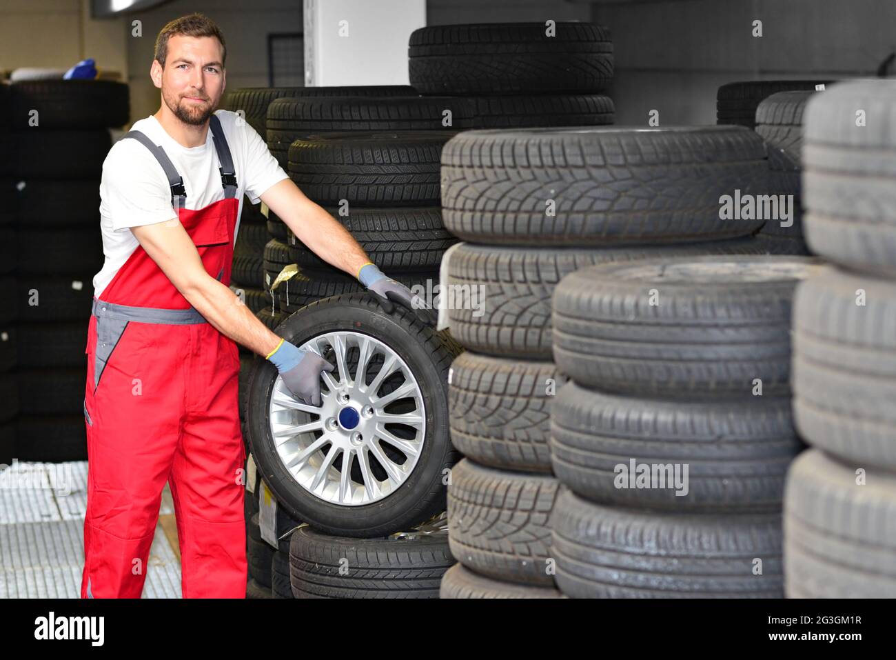 department store with car tyres in a garage tyre change Stock Photo