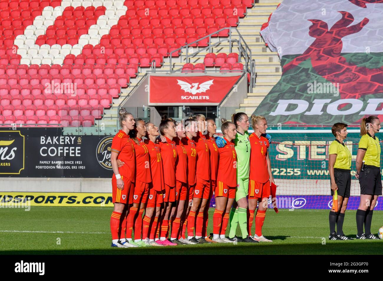 Llanelli, Wales. 15 June, 2021. The Wales Women's football team sing the National Anthem before the Women's International Friendly match between Wales Women and Scotland Women at Parc y Scarlets in Llanelli, Wales, UK on 15, June 2021. Credit: Duncan Thomas/Majestic Media/Alamy Live News. Stock Photo