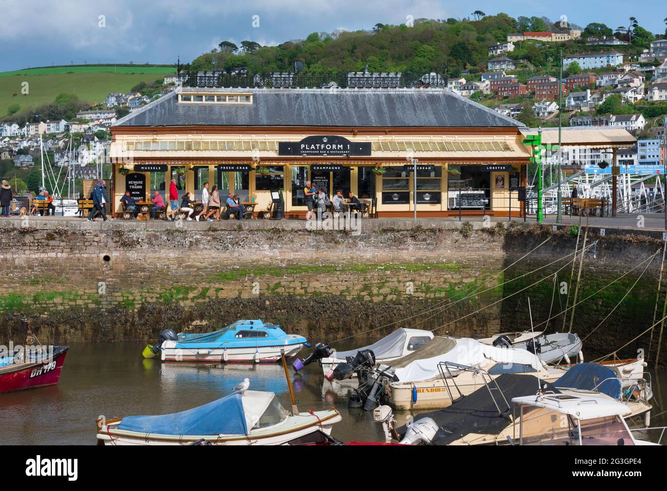 Platform 1 Dartmouth, view of the Platform 1 Champagne Bar And Restaurant, a former GWR station building sited beside Dartmouth harbour, Devon UK Stock Photo